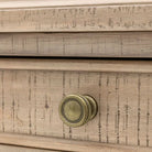 Close-up view of the Vancouver 3 Drawer Bedside, showcasing its distressed wood finish and brass knob detail.