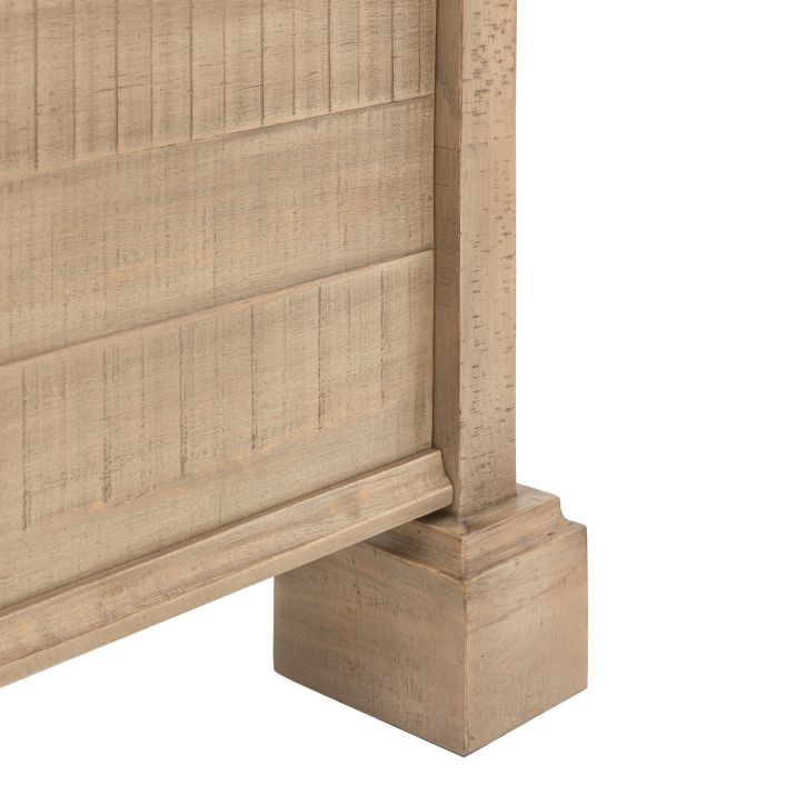 Close-up view of the corner detail and leg of the Vancouver 6' Bed, showcasing a textured wood finish with a sturdy square base.