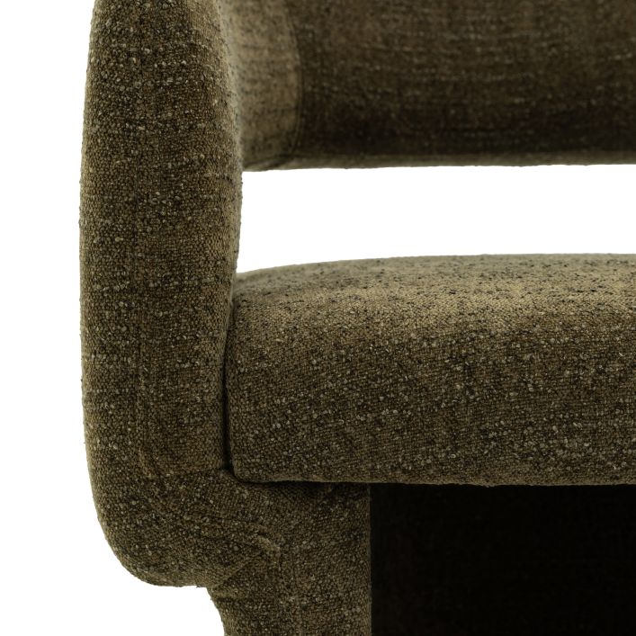 Close-up view of the Sloane Dining Chair in green/grey boucle fabric, showcasing its textured upholstery and cushioned backrest.