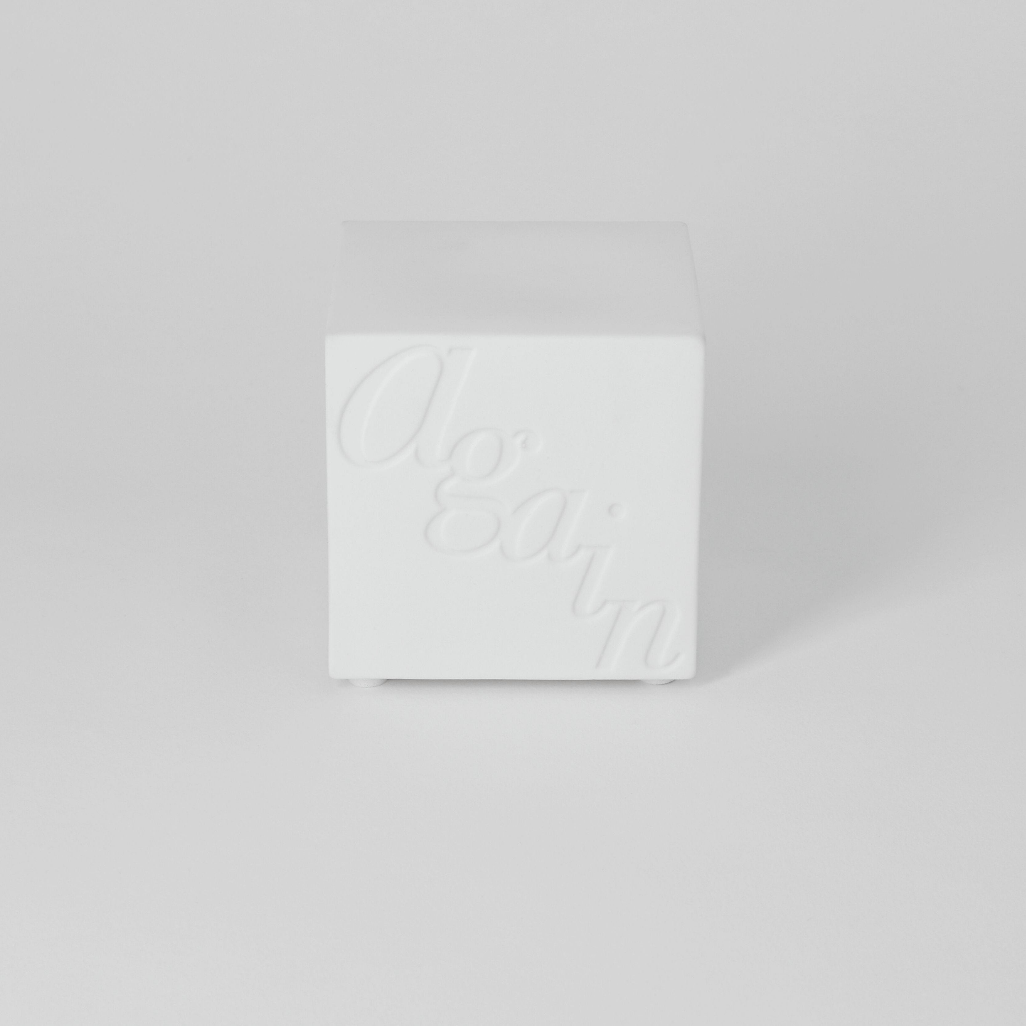 White textured box on a light gray background
