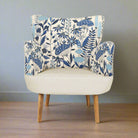 Chair with blue floral patterned backrest on a plain background