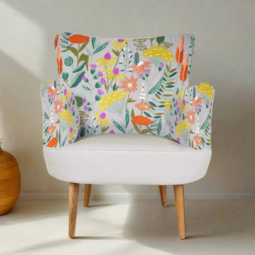 Chair with colorful floral pattern on the backrest against a white background