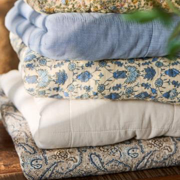 Quilt with blue, brown and sand coloured paisley pattern - WowCornwall