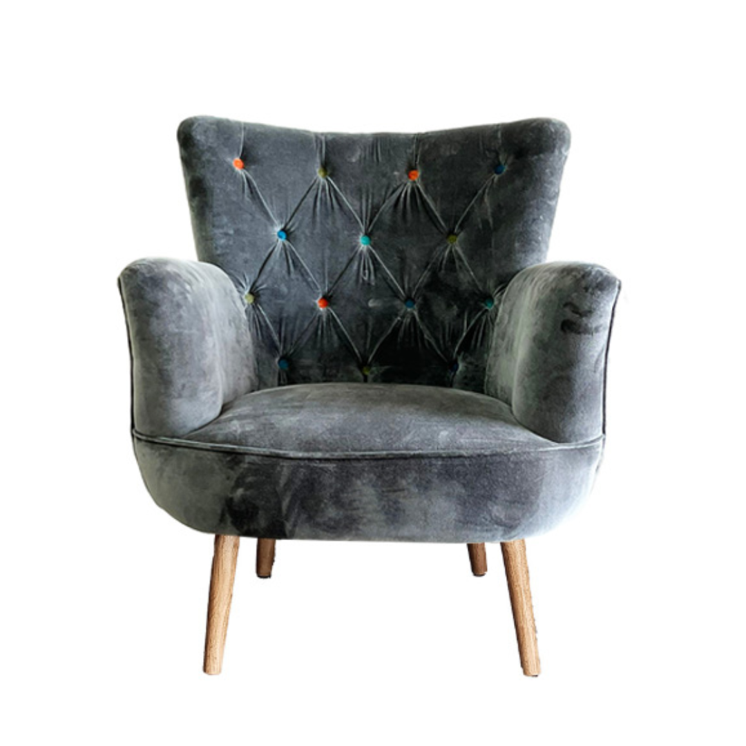 Gray velvet armchair with wooden legs on a white background