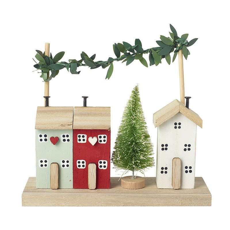 Wooden houses with leaf garland decoration - WowCornwall