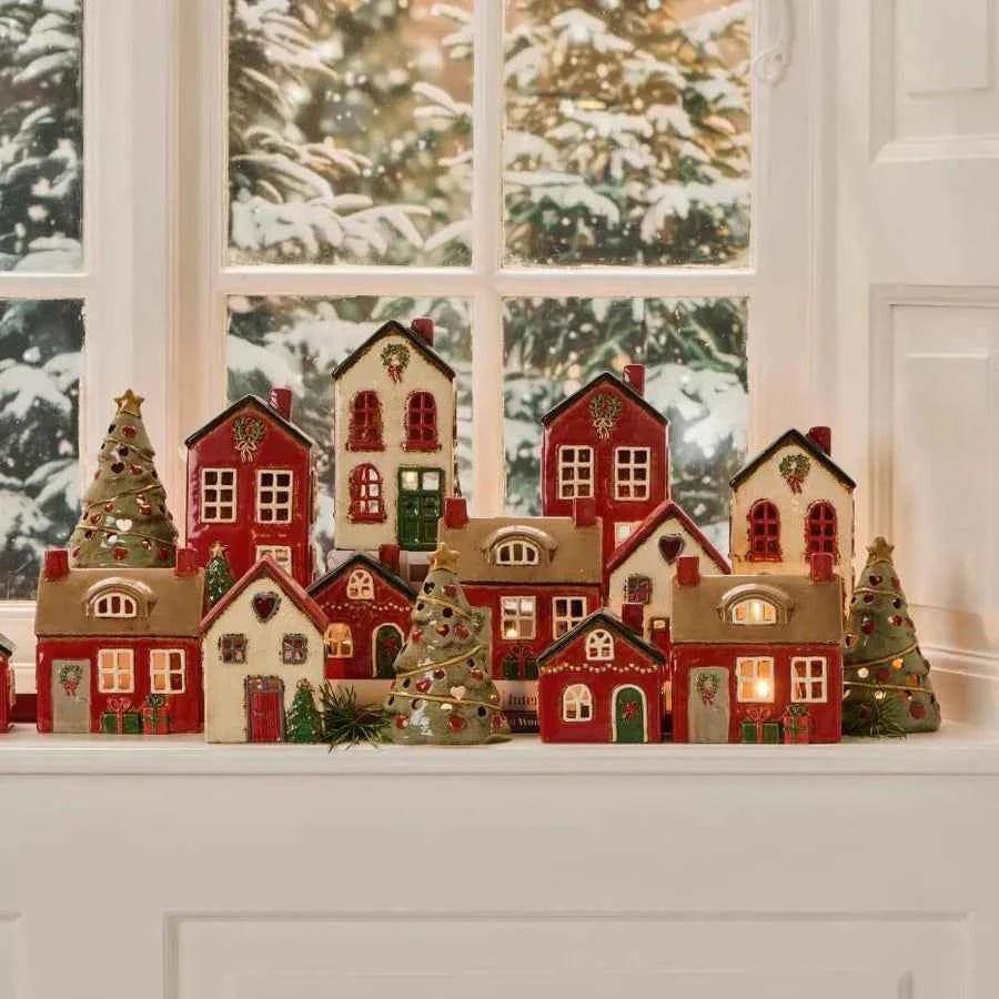 Ceramic house with door wreath and presents
