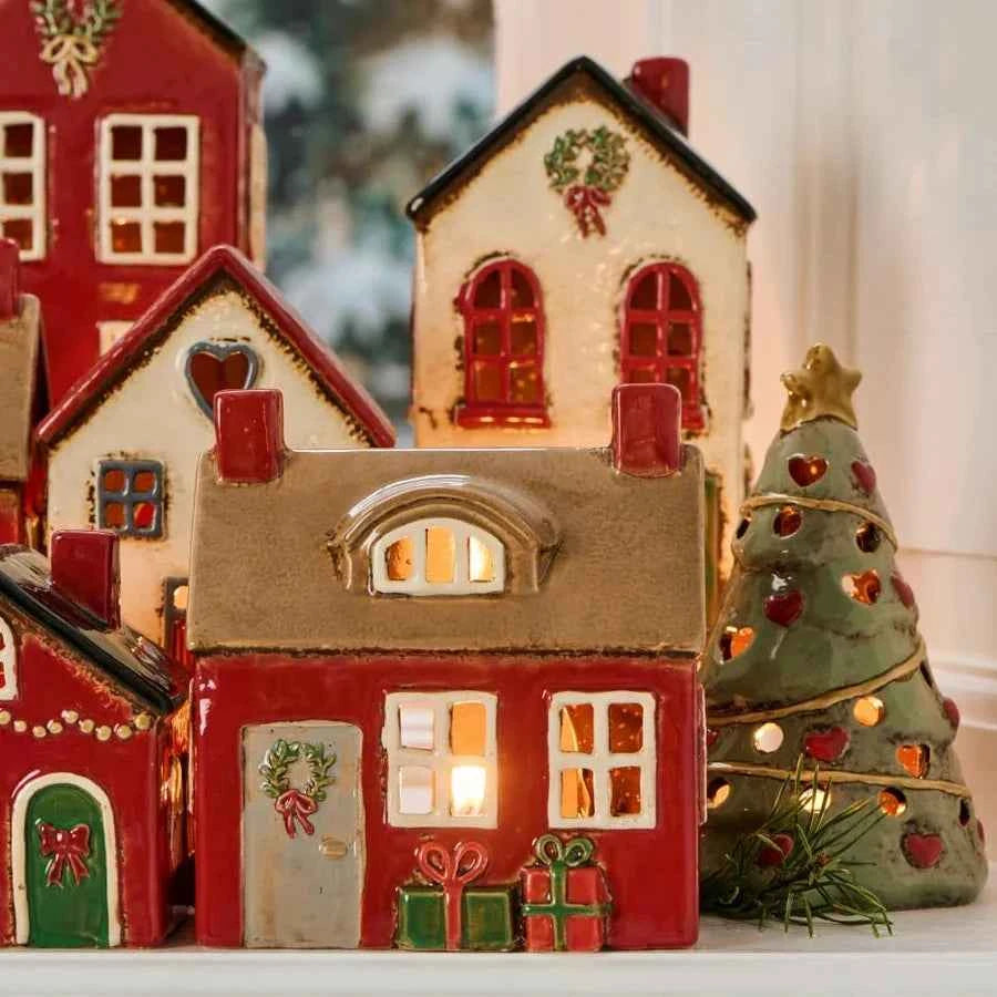 Ceramic house with door wreath and presents