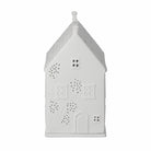 White ceramic house-shaped lantern with decorative patterns on a white background
