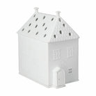 White house-shaped decorative item on a white background