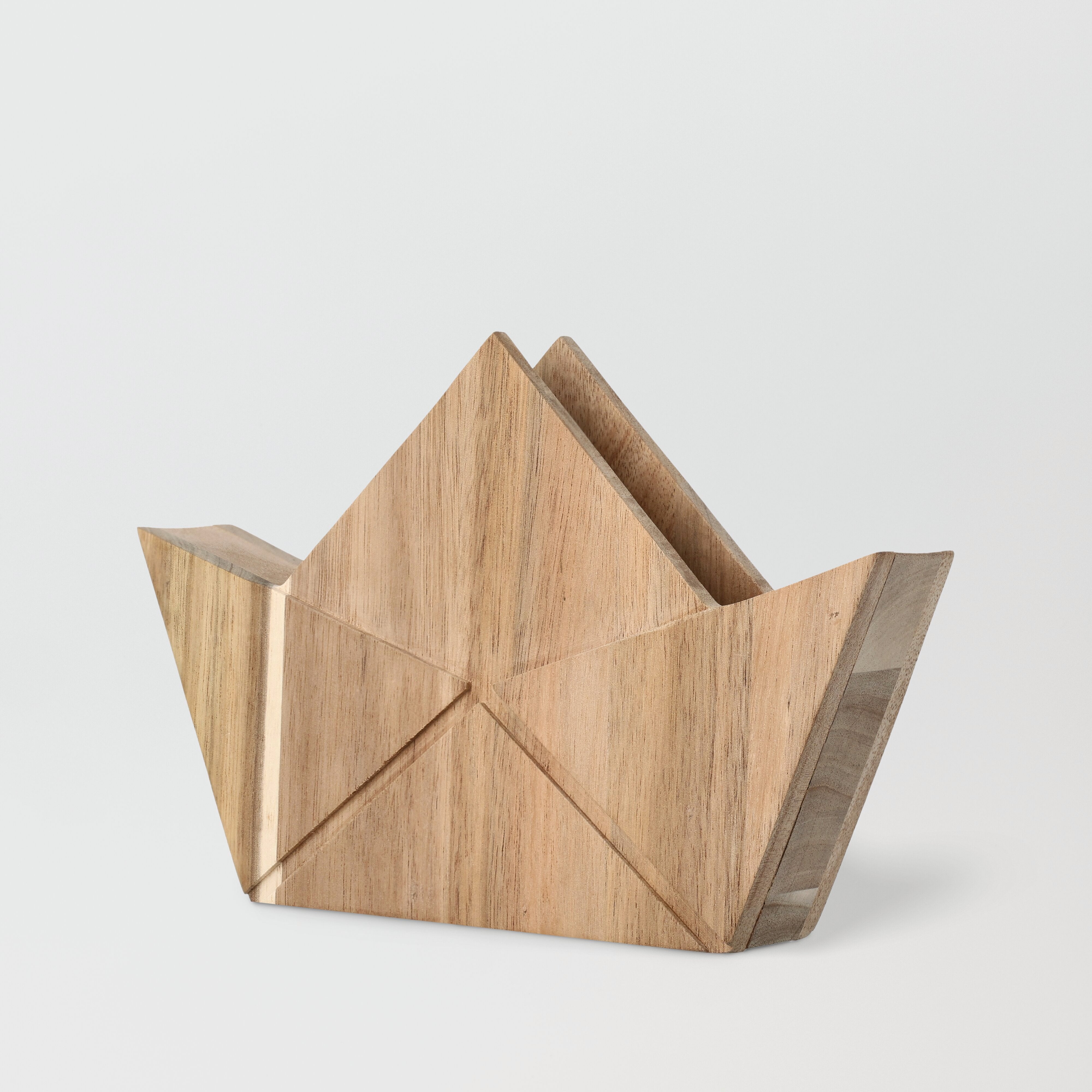 Wooden boat-shaped object on a light gray background