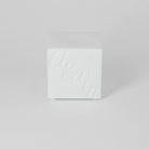 White textured box on a light gray background
