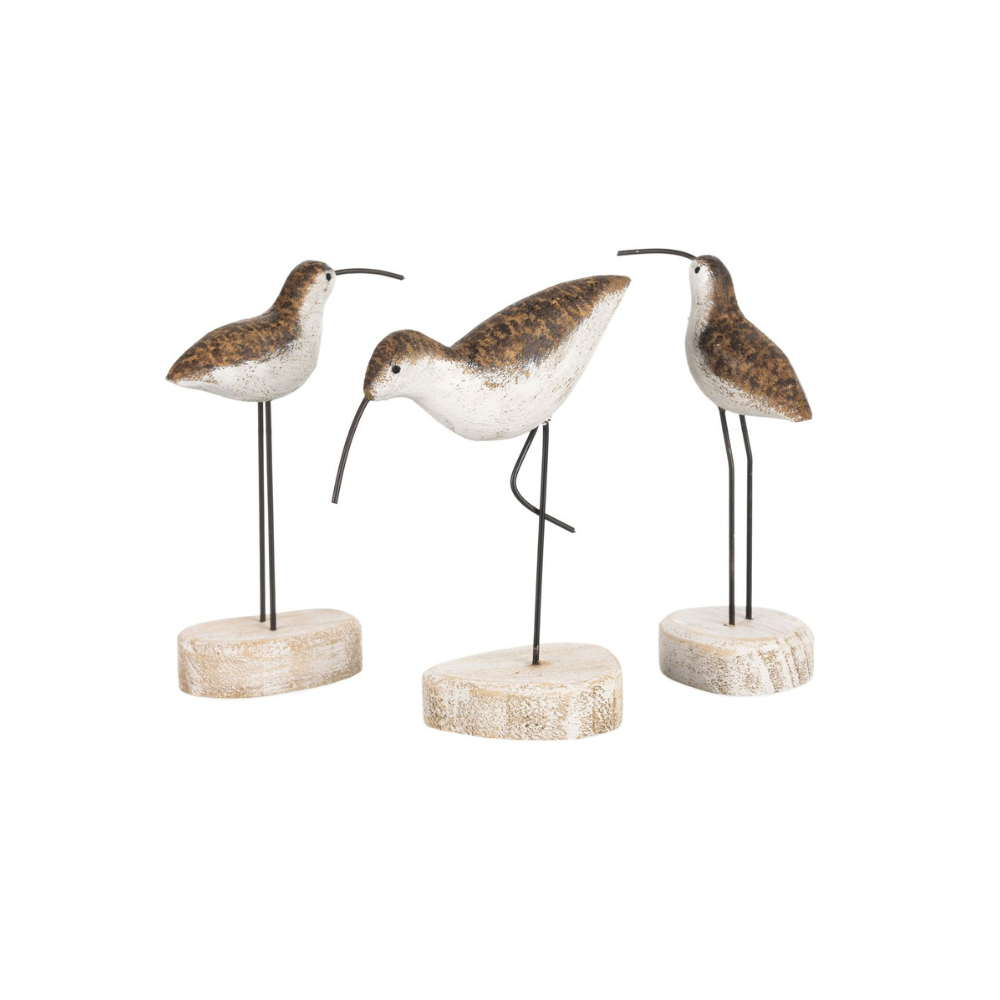 Three decorative bird figures on stands with a white background
