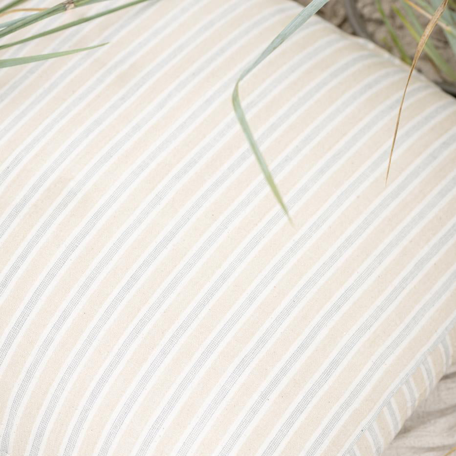 Beige and blue striped fabric with a natural background