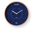 Wall clock with wooden frame and blue face displaying the brand 'Douze'.
