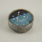 Sieval candle with 'Orange & Cinnamon' label on a plain background