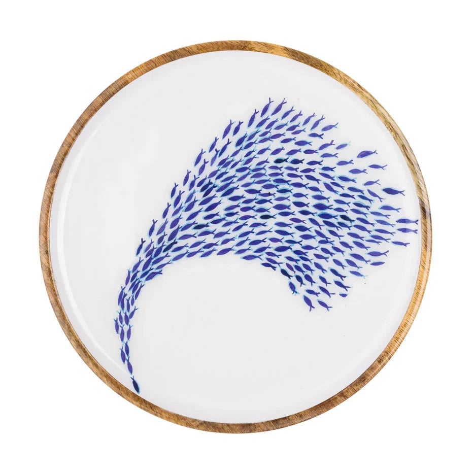 Round white plate with blue abstract design on a white background