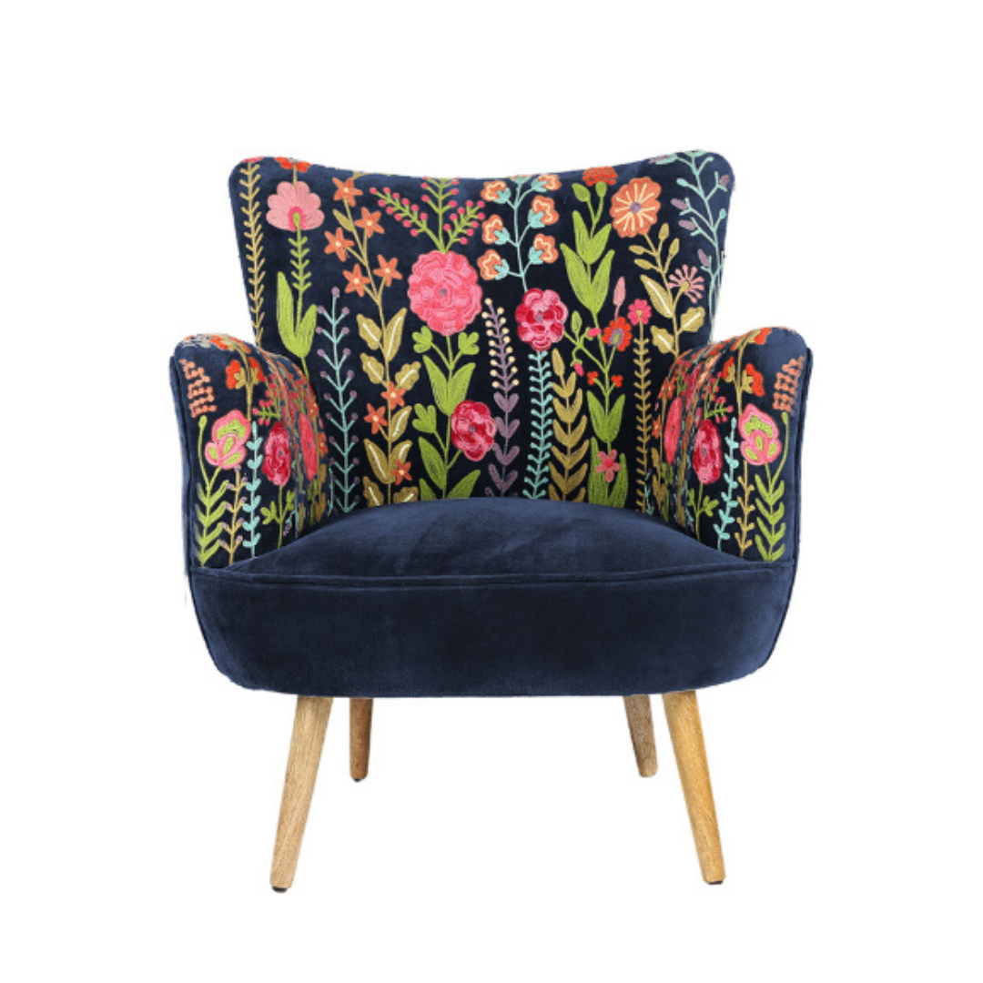 Navy armchair with floral pattern on a white background